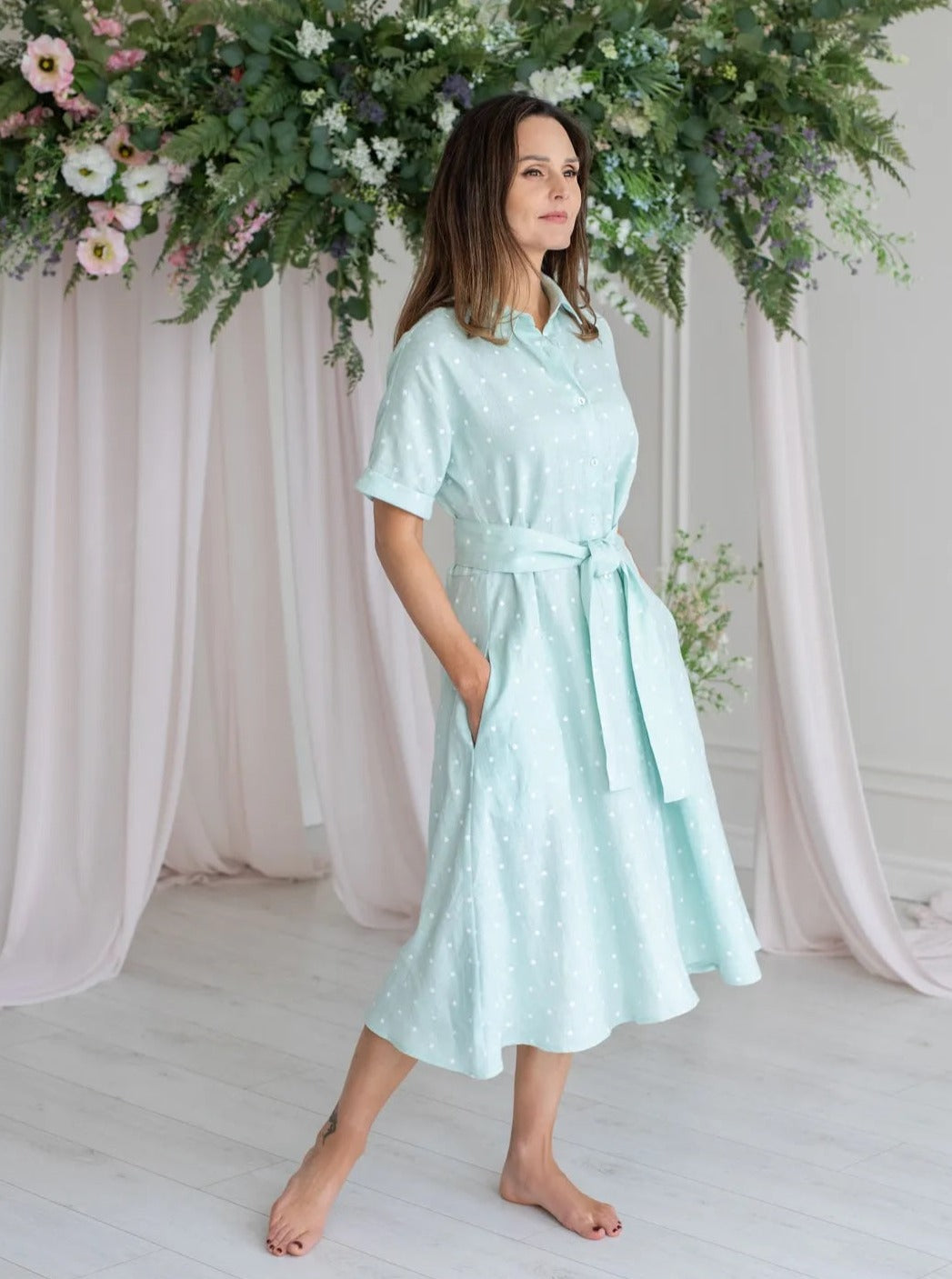 Woman wearing min polka dot dress