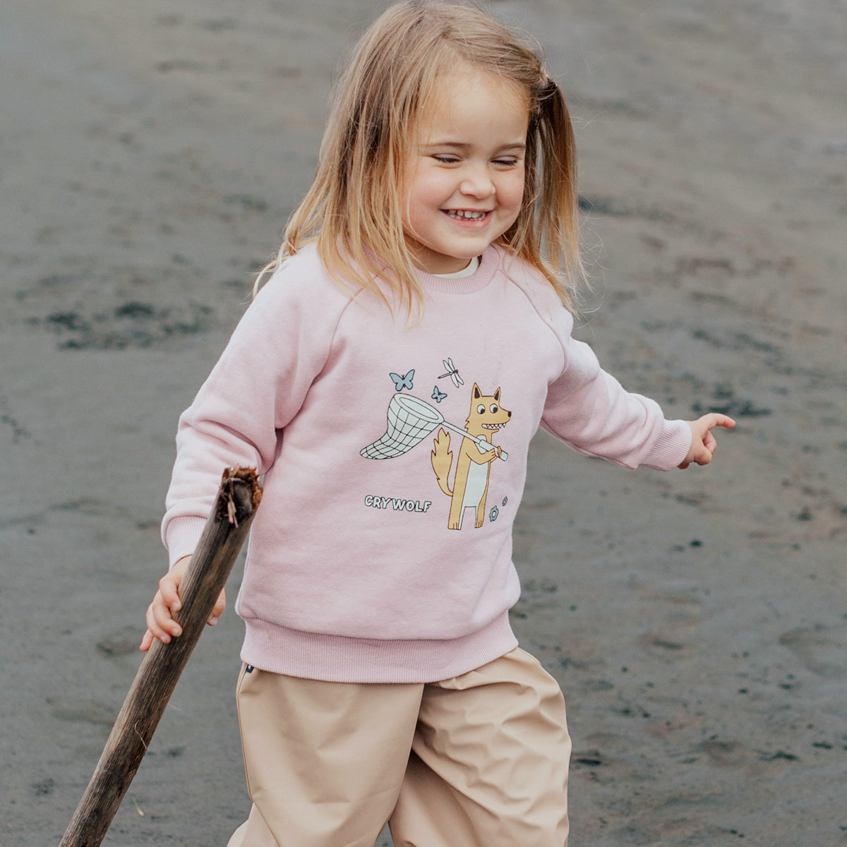 girl wearing pink sweater