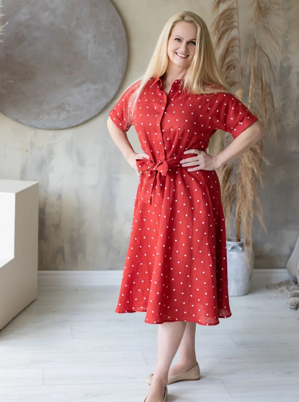 Woman wearing red polka dot dress