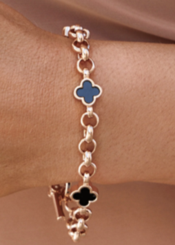Model wearing rose gold chain bracelet with three black flowers