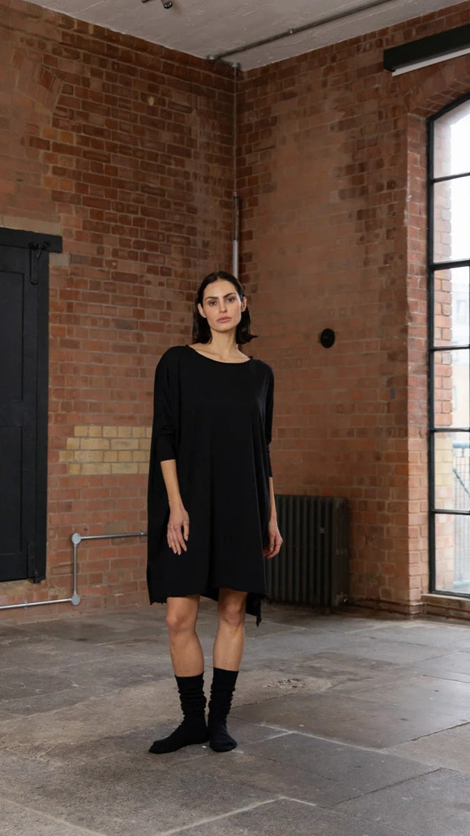 Woman wearing black long sleeve t shirt dress