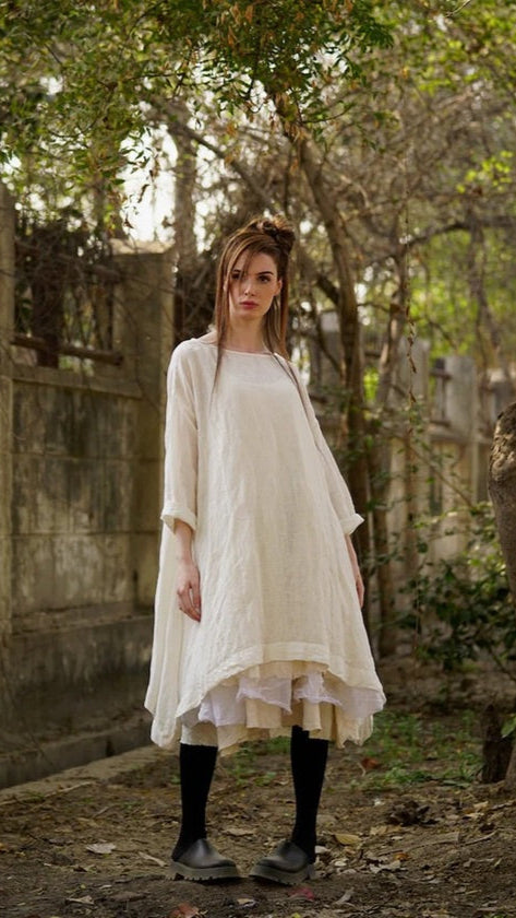 Woman wearing gauze dress in cream