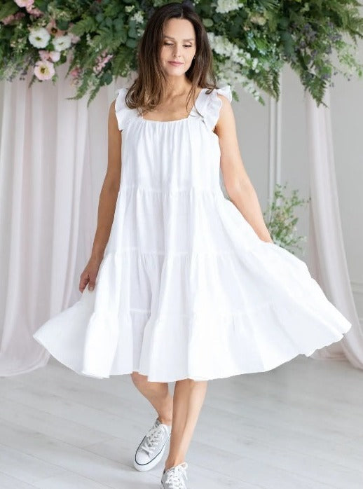 Woman wearing white linen dress