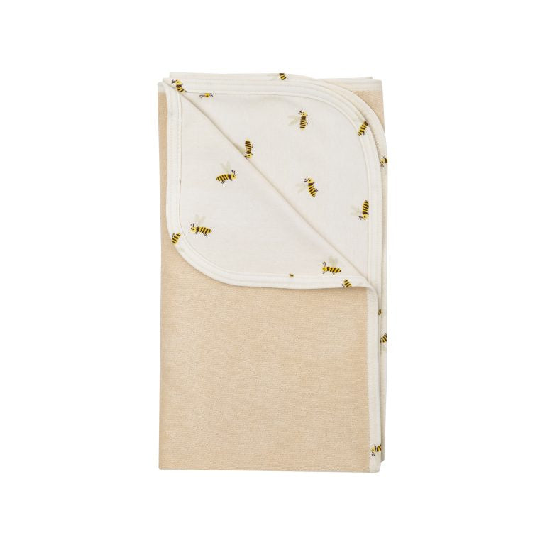 Natural terry blanket with bees on one side.