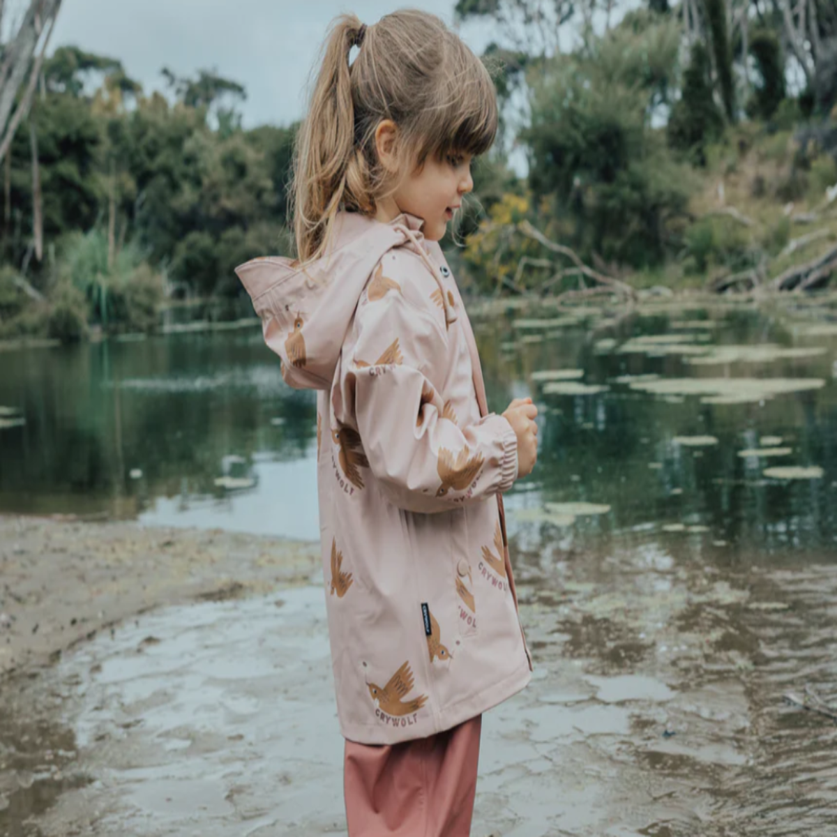 Girl wearing Tui jacket side view