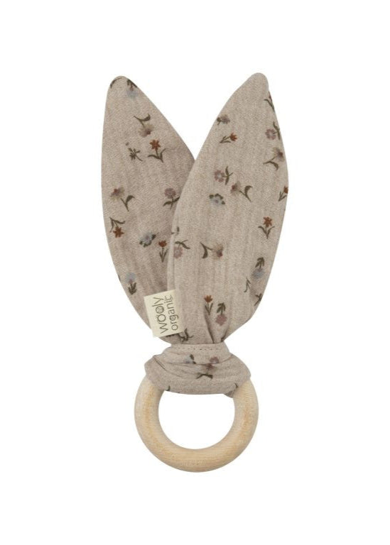 Grey muslin teething ring with flower fabric and bunny ears.