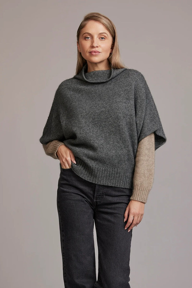 Woiman wearing a charcoal grey merino & possum shrug sweater.