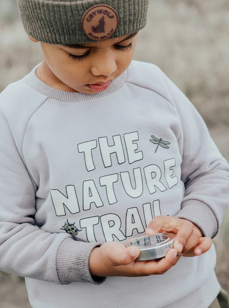 boy wearing light grey sweater