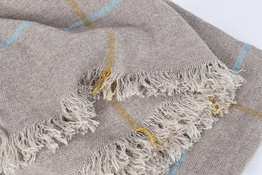 close up natural linen throw herringbone