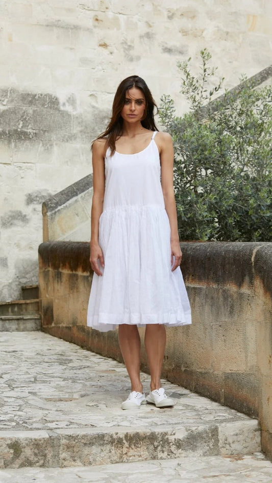 Woman wearing slip dress with cotton organdy.