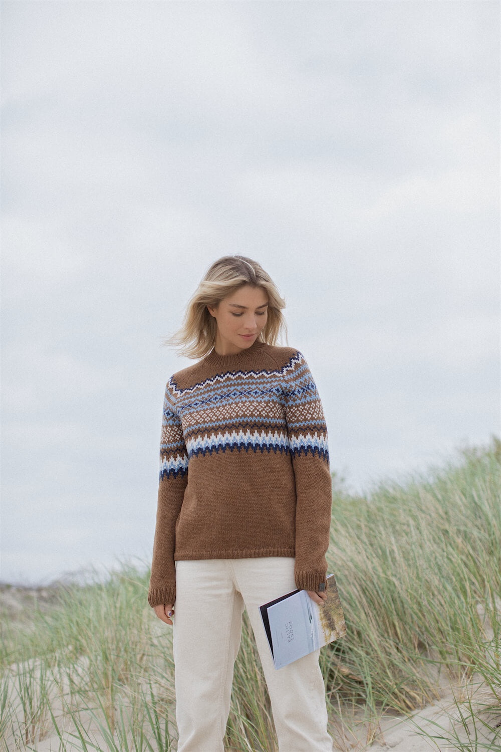 lady wearing brown nordic pattern sweater