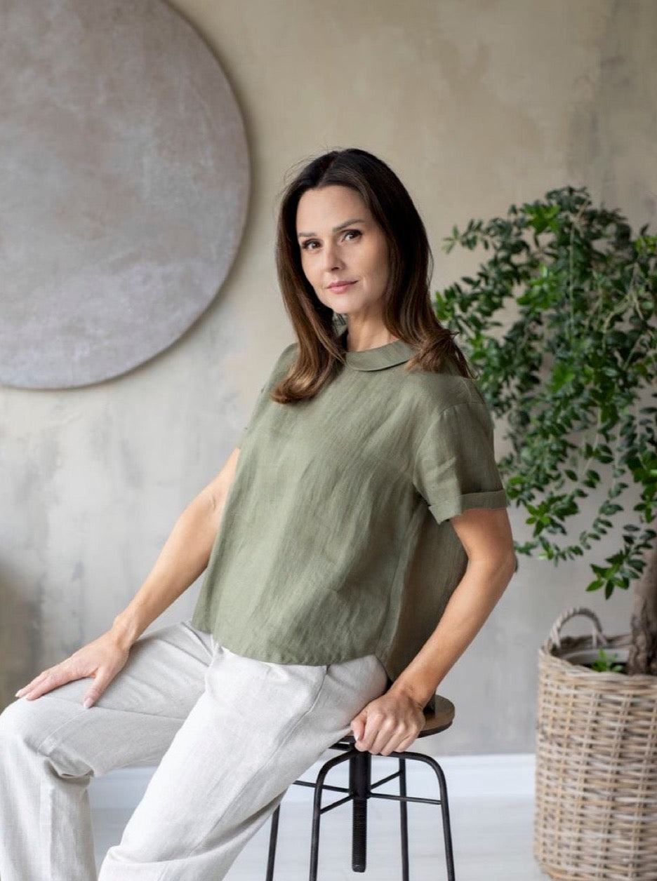Woman wearing Zoe green linen shirt