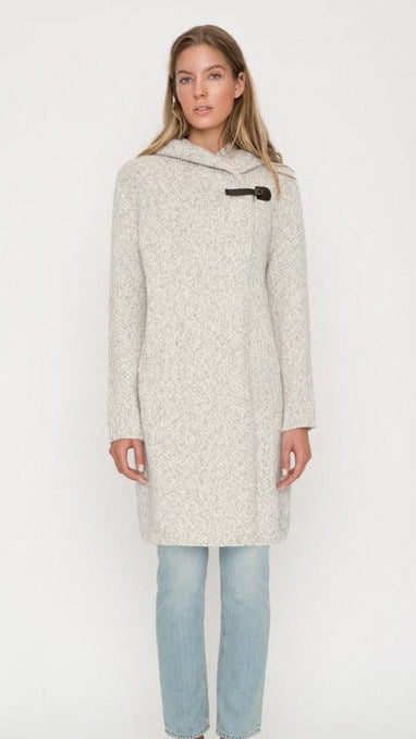 Woman wearing wool coat with hood