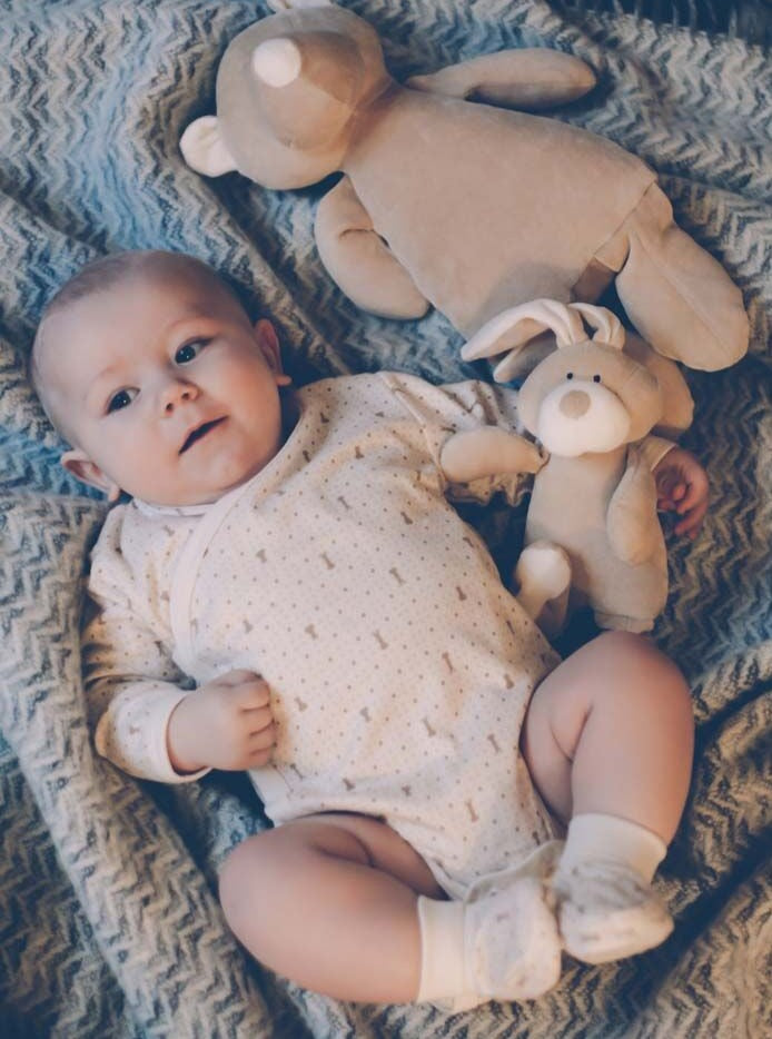 Baby wearing organic cotton bodysuit