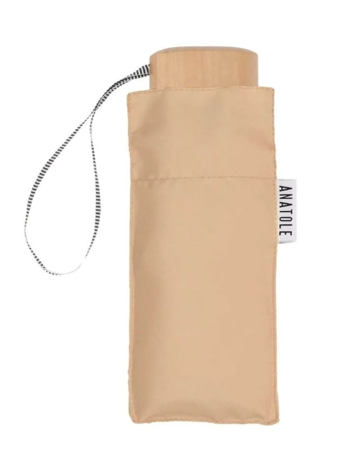 Beige umbrella folded