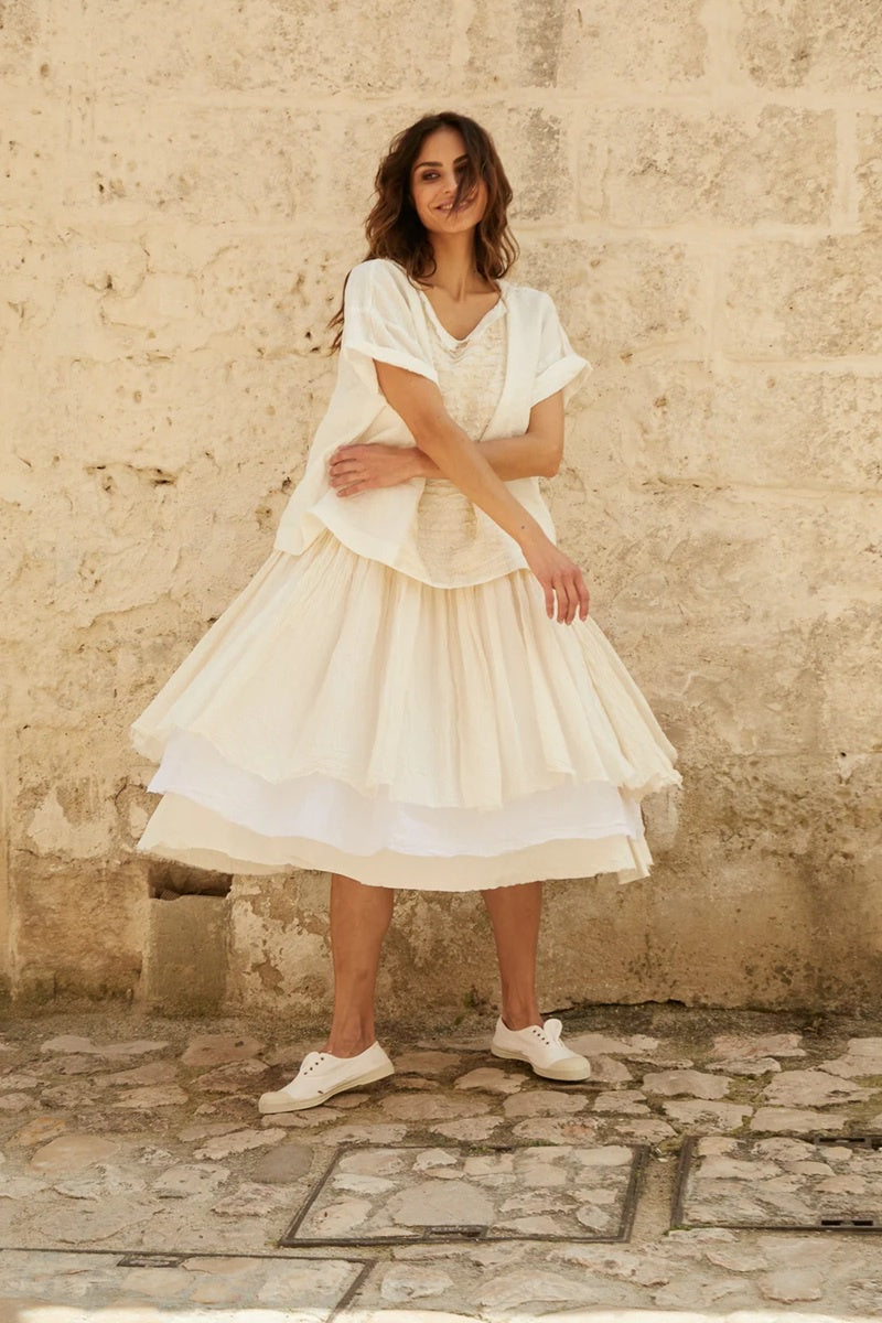 Woman wearing short slip dress made with cotton twill and cotton organdy.