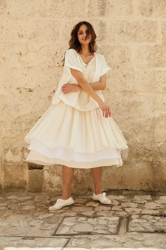 Woman wearing short slip dress made with cotton twill and cotton organdy.