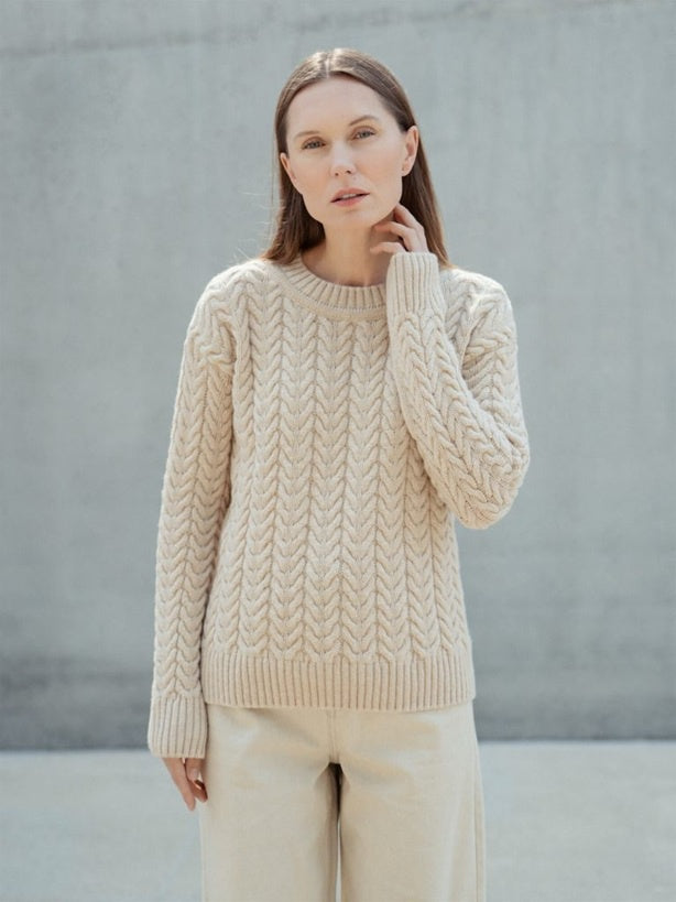 Crew neck cable neck sweater in sand.