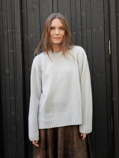 Cashmere and merino beige sweater with rib neck, cuff and hem.