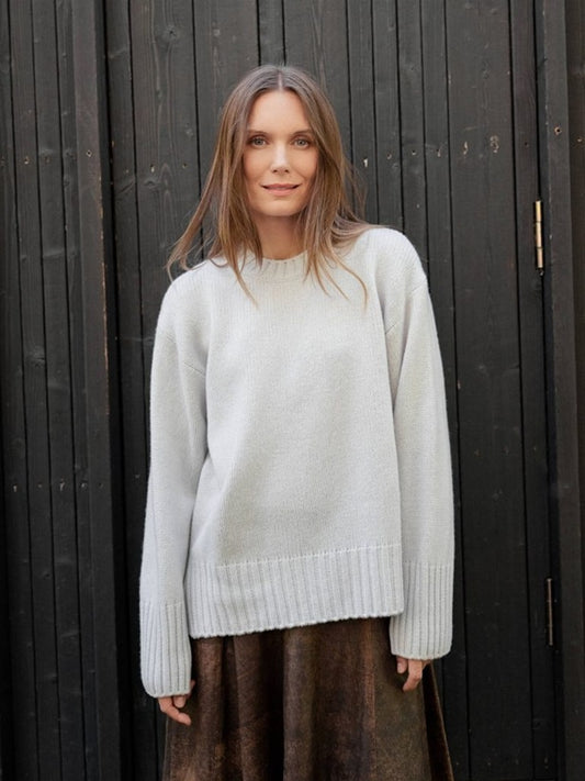 Cashmere and merino beige sweater with rib neck, cuff and hem.