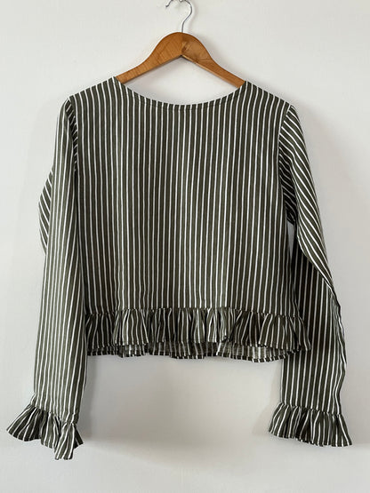 Cropped linen shirt with fill around hem and end of sleeves in green linen stripe.