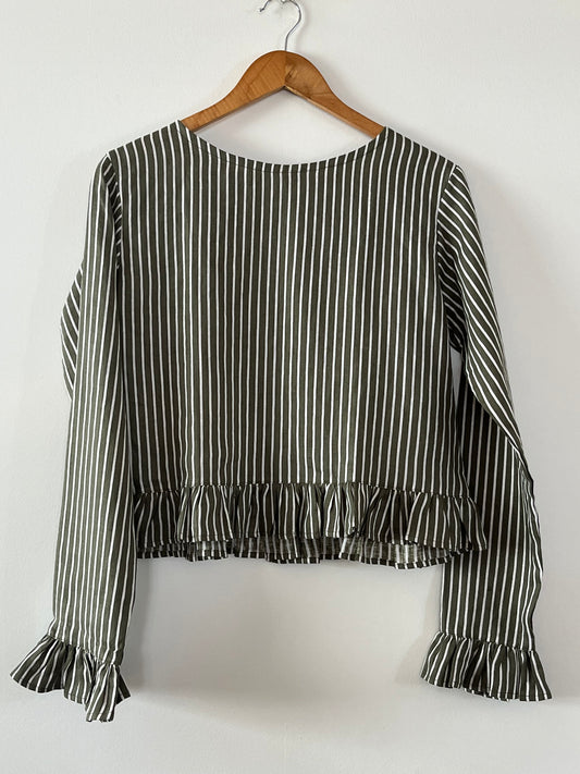 Cropped linen shirt with fill around hem and end of sleeves in green linen stripe.