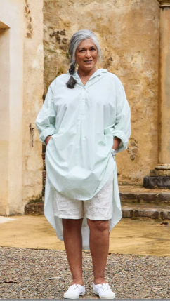 Woman wearing green harper cotton shirt