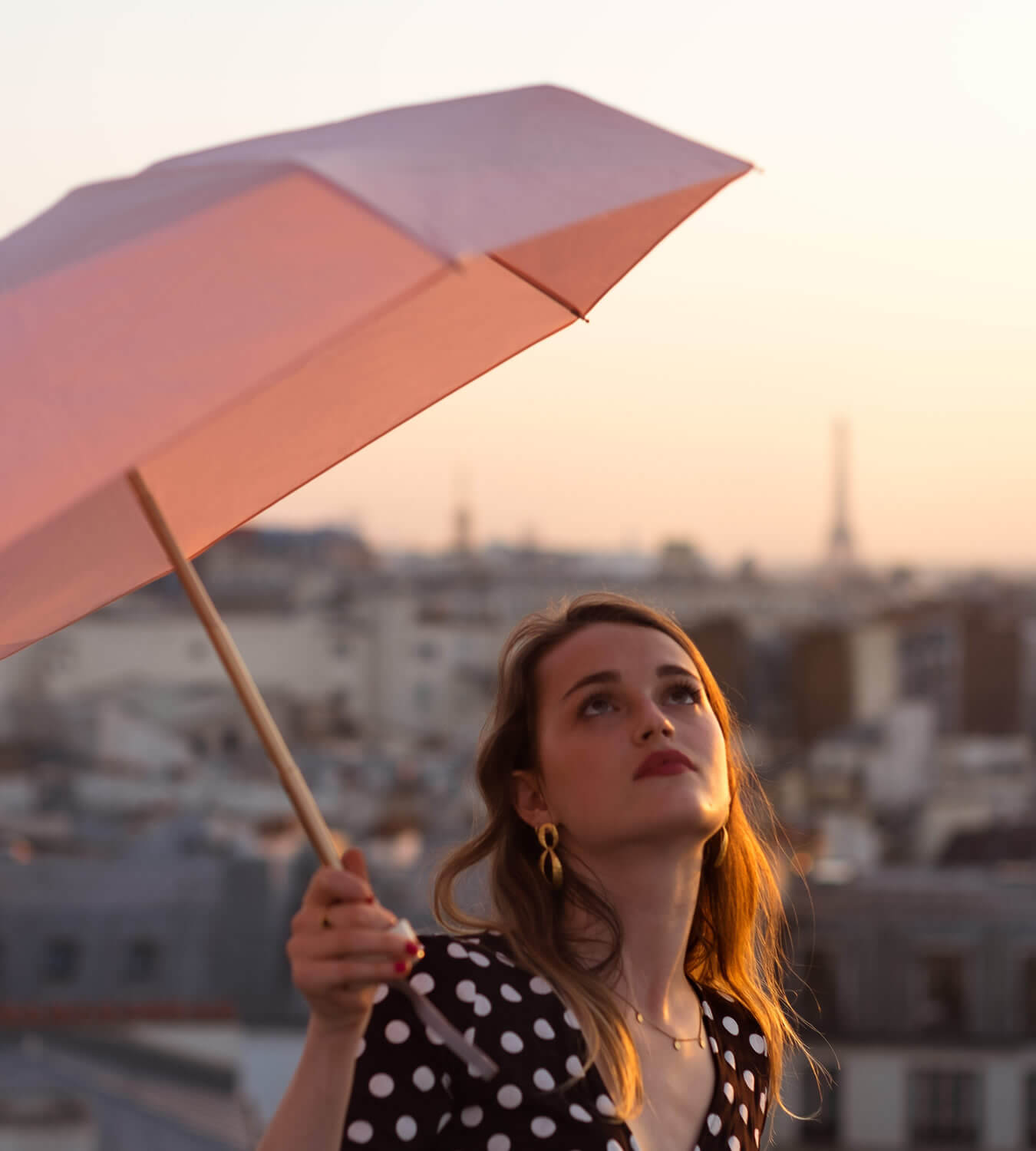 lady with pink open umbrella