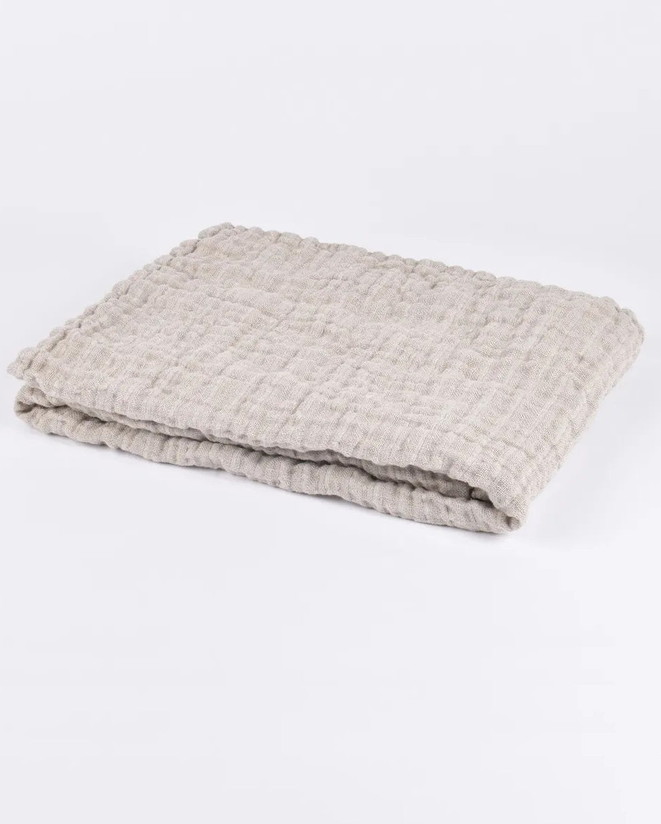 Linen baby blanket in natural colour.