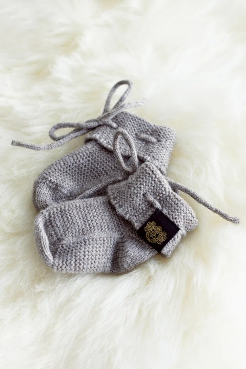 New born baby booties in natural merino knit.