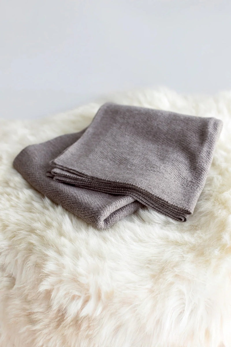 Baby blanket in natural undyed wool.