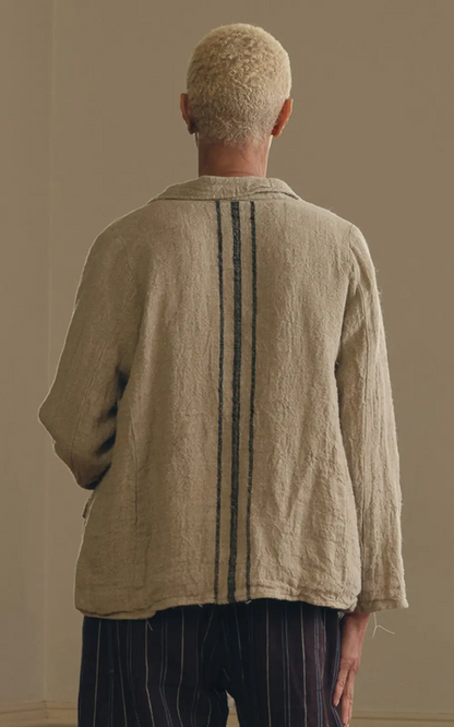 Back view of a raw linen women's jacket with vertical stripes, relaxed fit, neutral tone