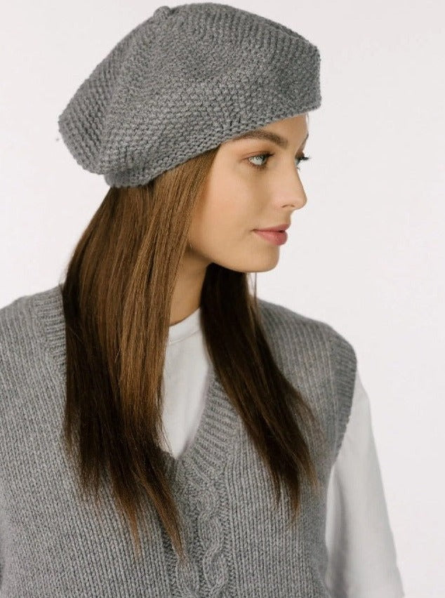 Woman wearing grey textured wool beret