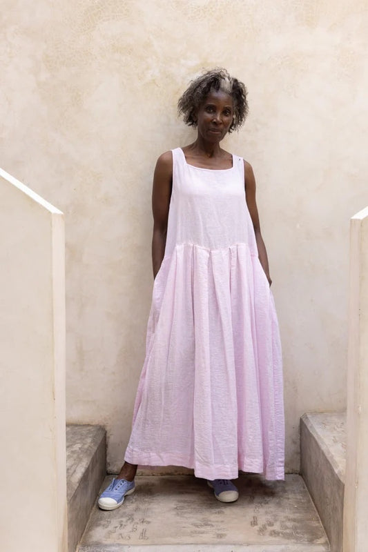 Woman wearing pale pink linen sundress