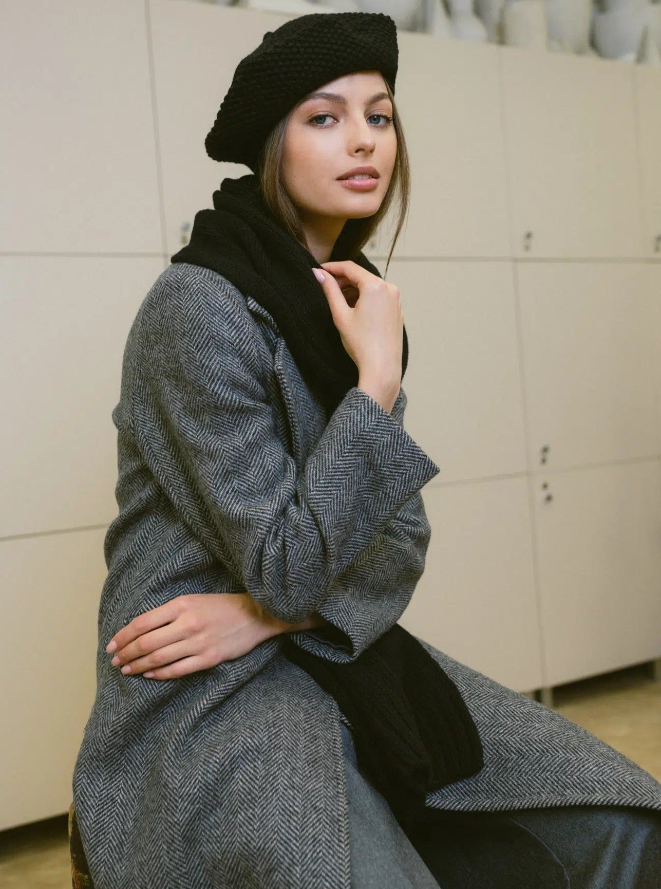 woman wearing black beret side view