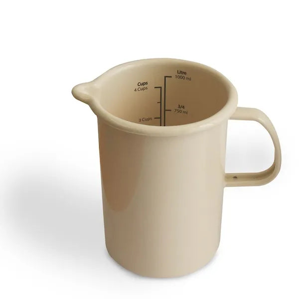 Beige enamel measuring jug with handle and interior volume markings