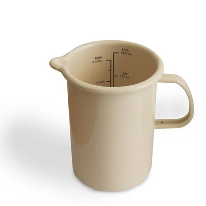 Beige enamel measuring jug with handle and interior volume markings