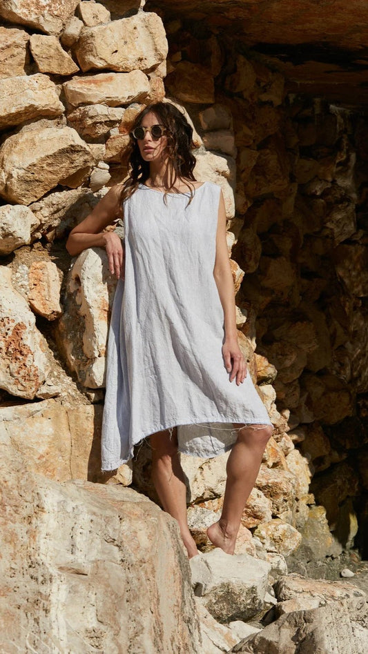 Woman wearing pale blue stripe linen A line dress