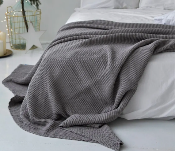 light grey waffle bed cover on bed