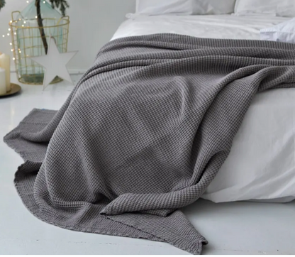 light grey waffle bed cover on bed