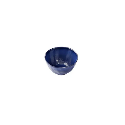 Small ceramic blue bowl with glossy finish on white background