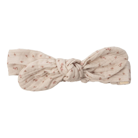 Muslin bow head band with pink flowers.