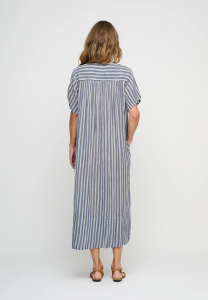 Woman  wearing short sleeve blue stripe shirt dress back view.