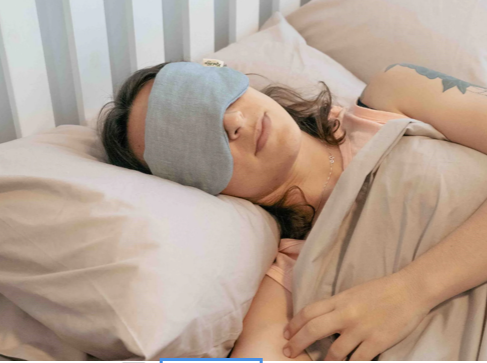 blue mask lady in bed