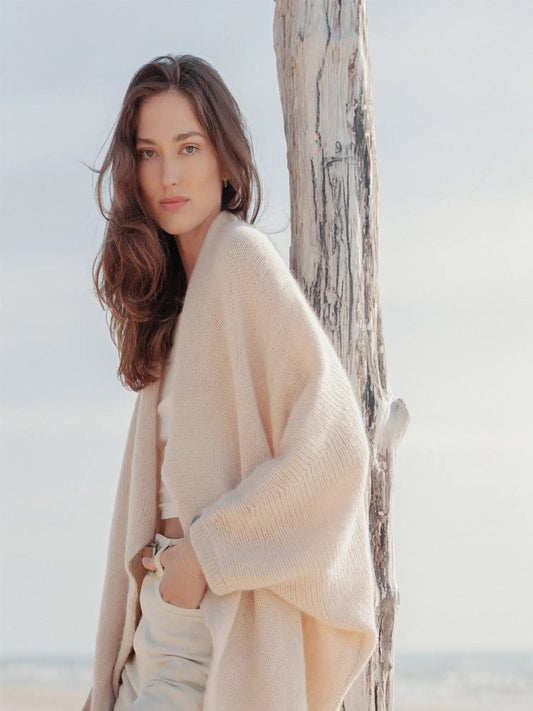 Woman wearing cream mohair wrap side view