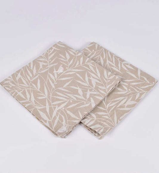 Setr of 4 linen napkins in sand with leaf pattern.