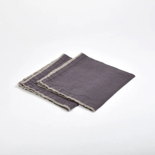 Set of four linen napkins in aubergine.