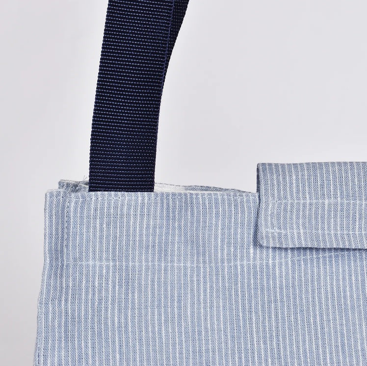 close up of linen lunch bag with light blue stripes