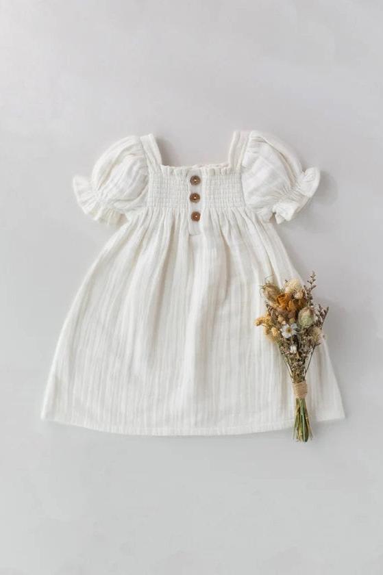 white cotton muslin dress with puff sleeve and shirred front