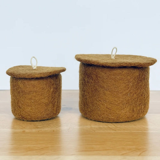 Ochre felt table pot with lid .